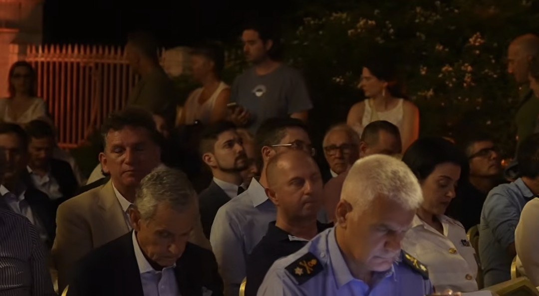 Prince Constantine seated with officials